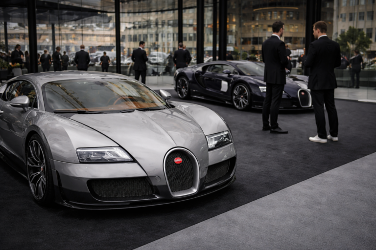 AI-generated image of Bugatti hypercars displayed inside a modern glass pavilion during an exclusive luxury automotive showcase event.