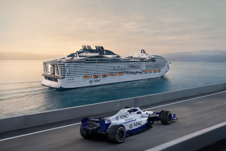 AI-generated image of a Formula 1 race car speeding along a seaside circuit while a large MSC Cruises ship sails in the background on calm Mediterranean waters.