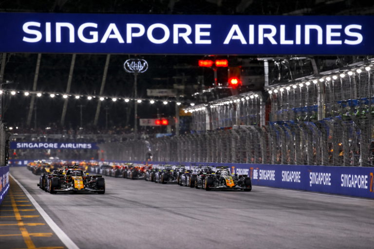 AI-generated image of Formula 1 cars racing under the Singapore Airlines banner during the Singapore Grand Prix night race, captured on a floodlit street circuit in a 4:3 editorial motorsport scene.
