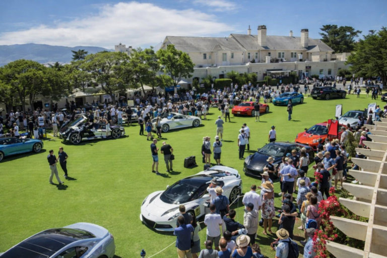 AI-generated scene of a luxury supercar showcase at an exclusive concours-style automotive event, with crowds gathering around rare performance cars on a manicured lawn.