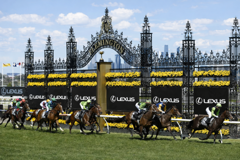 AI-generated image of thoroughbred horses racing past the iconic Flemington gates during the Melbourne Cup at Flemington Racecourse.