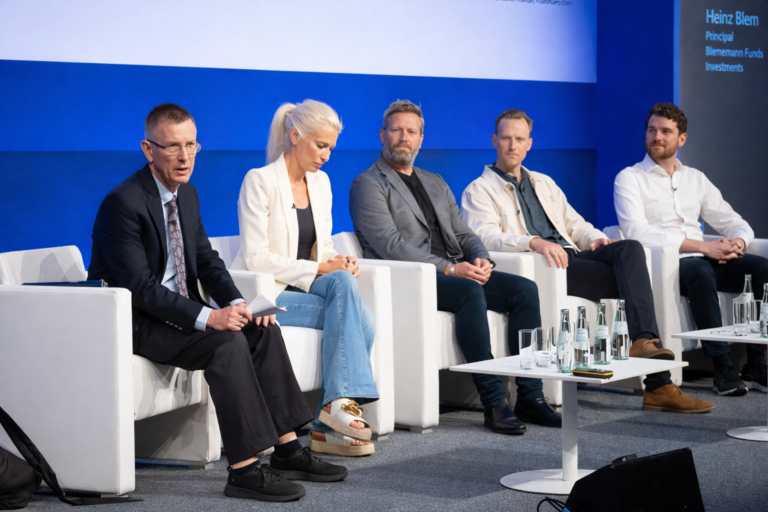 AI-generated image of a private markets investment panel discussion with industry speakers seated on stage at the ILPA European Summit.