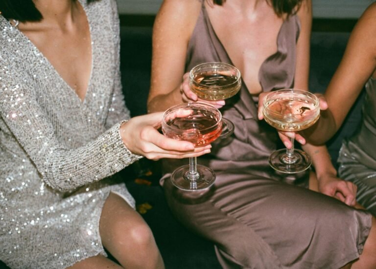 Elegant guests toasting champagne glasses at an upscale luxury gathering